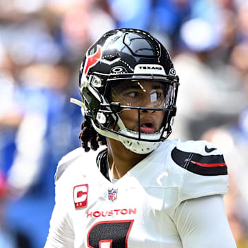 Sep 8, 2024; Indianapolis, Indiana, USA;  Houston Texans quarterback C.J. Stroud (7) looks for a teammate during the first quarter against the Indianapolis Colts at Lucas Oil Stadium. Mandatory Credit: Marc Lebryk-Imagn Images