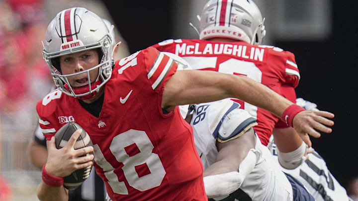 Aug 31, 2024; Columbus, OH, USA; Ohio State Buckeyes quarterback Will Howard (18) scrambles out of the pocket during the NCAA football game against the Akron Zips at Ohio Stadium. Ohio State won 52-6.