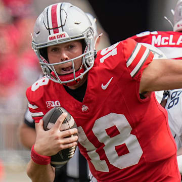 Aug 31, 2024; Columbus, OH, USA; Ohio State Buckeyes quarterback Will Howard (18) scrambles out of the pocket during the NCAA football game against the Akron Zips at Ohio Stadium. Ohio State won 52-6.