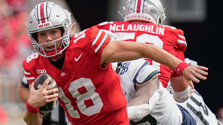 Aug 31, 2024; Columbus, OH, USA; Ohio State Buckeyes quarterback Will Howard (18) scrambles out of the pocket during the NCAA football game against the Akron Zips at Ohio Stadium. Ohio State won 52-6.