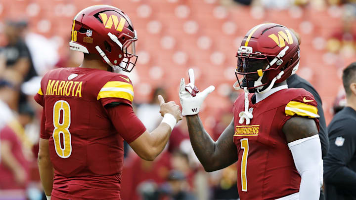 Washington Commanders quarterback Marcus Mariota and wide receiver Deebo Samuel Sr. 