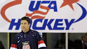 Aug 27, 2013; Arlington, VA, USA; Former  NHL player and Olympic team member Chris Drury walks onto the ice during a ceremony unveiling the 2014 Olympic hockey jersey as part of the 2013 U.S. men's national team camp at Kettler Capitals Iceplex. Mandatory Credit: Geoff Burke-Imagn Images