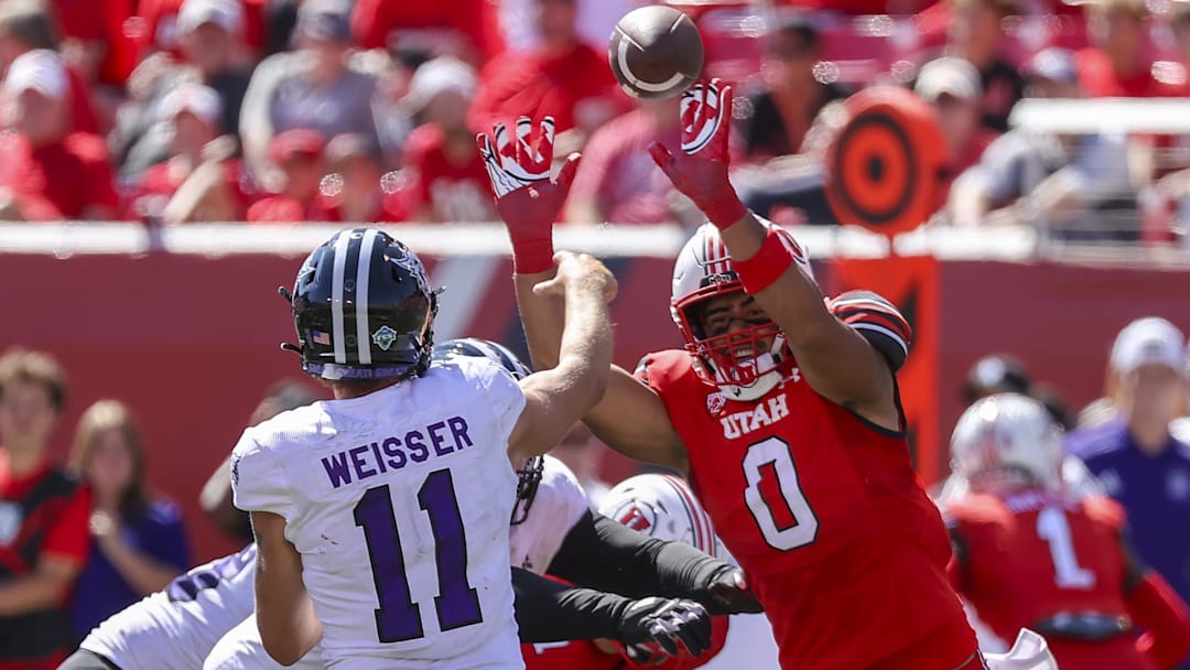 Sep 16, 2023; Salt Lake City, Utah, USA; Utah Utes defensive end Logan Fano (0) pressures Weber State Wildcats quarterback Kylan Weisser (11) in the second half at Rice-Eccles Stadium. Mandatory Credit: Rob Gray-Imagn Images
