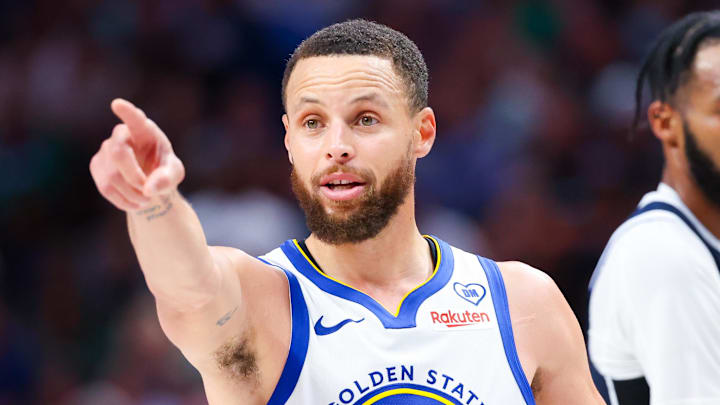 Apr 5, 2024; Dallas, Texas, USA;  Golden State Warriors guard Stephen Curry (30) reacts in front of Dallas Mavericks forward Derrick Jones Jr. (55) during the second half at American Airlines Center. 