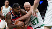 Nov 5, 2025; Boston, Massachusetts, USA; Washington Wizards forward Cam Whitmore (1) and Boston Celtics guard Jordan Walsh (27) work for the ball in the first quarter at TD Garden. Mandatory Credit: David Butler II-Imagn Images