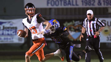 Brady Hart of Cocoa is pursued by Titusville’s Dwight Jenkins during their District 12-2S football game Friday, October 13, 2023.
