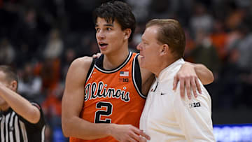 Dec 6, 2025; Nashville, Tennessee, USA;  Illinois Fighting Illini guard Andrej Stojakovic (2) celebrates the win with head coach Brad Underwood against the Tennessee Volunteers during the second half at Bridgestone Arena. Mandatory Credit: Steve Roberts-Imagn Images