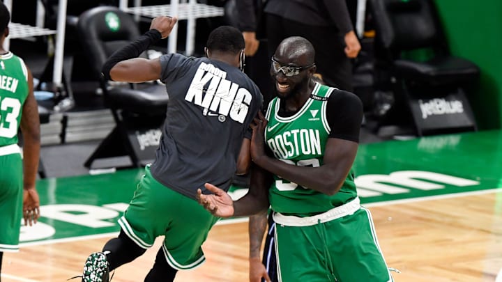 Jan 15, 2021; Boston, Massachusetts, USA; Boston Celtics center Tacko Fall (99) celebrates with guard Jaylen Brown (7) after defeating the Orlando Magic at the TD Garden. Mandatory Credit: Brian Fluharty-Imagn Images