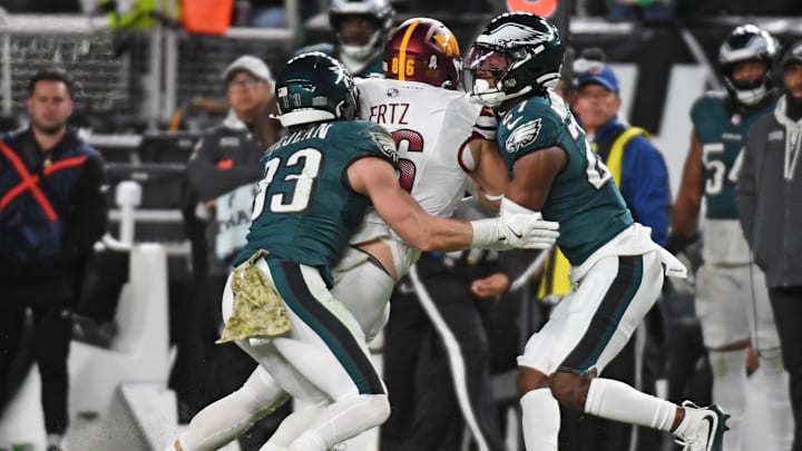 hiladelphia Eagles cornerback Cooper DeJean and cornerback Quinyon Mitchell tackle Washington Commanders player
