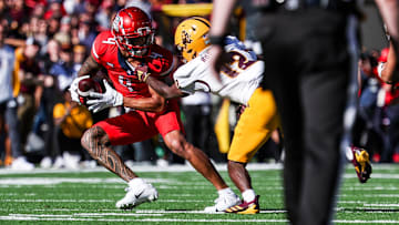  Arizona State Sun Devils defensive back Javan Robinson attempts to tackle Arizona Wildcats wide receiver Tetairoa McMillan.