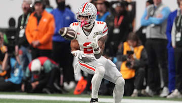 Jan 20, 2025; Atlanta, GA, USA; Ohio State Buckeyes wide receiver Emeka Egbuka (2) catches a pass against the Notre Dame Fighting Irish in the first half in the CFP National Championship college football game at Mercedes-Benz Stadium. Mandatory Credit: Dale Zanine-Imagn Images