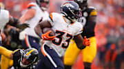 Sep 15, 2024; Denver, Colorado, USA; Denver Broncos running back Javonte Williams (33) carries the ball in the second half against the Pittsburgh Steelers at Empower Field at Mile High. 