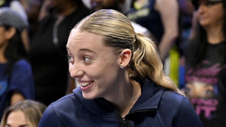 Dallas Wings guard Paige Bueckers smiles after she avoids guard Arike Ogunbowale. Dallas Wings guard Paige Bueckers smiles after she avoids guard Arike Ogunbowale.