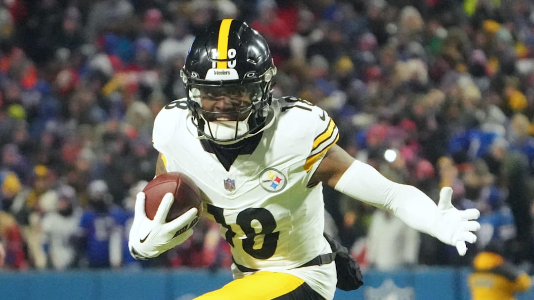 Jan 15, 2024; Orchard Park, New York, USA; Pittsburgh Steelers wide receiver Diontae Johnson (18) runs the ball in the second half against the Buffalo Bills in a 2024 AFC wild card game at Highmark Stadium. Mandatory Credit: Kirby Lee-Imagn Images