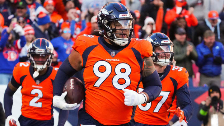 Nov 26, 2023; Denver, Colorado, USA; Denver Broncos defensive tackle Mike Purcell (98) following a defensive stop in the first quarter against the Cleveland Browns at Empower Field at Mile High. 