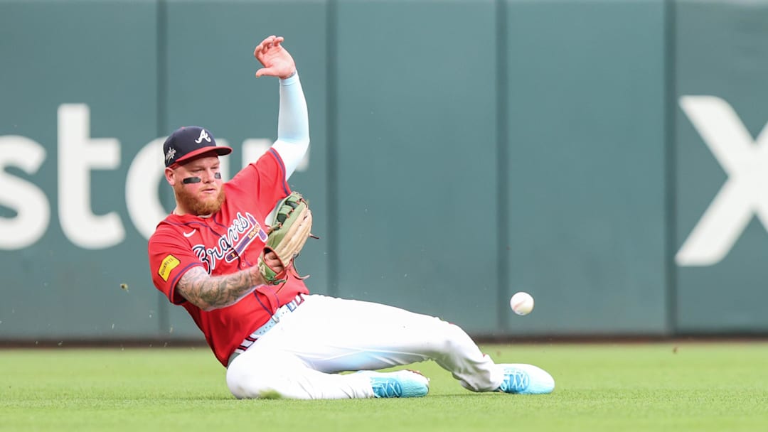 Alex Verdugo (8) makes an error in the field against the Colorado Rockies during the second inning at Truist Park. Alex Verdugo (8) makes an error in the field against the Colorado Rockies during the second inning at Truist Park.