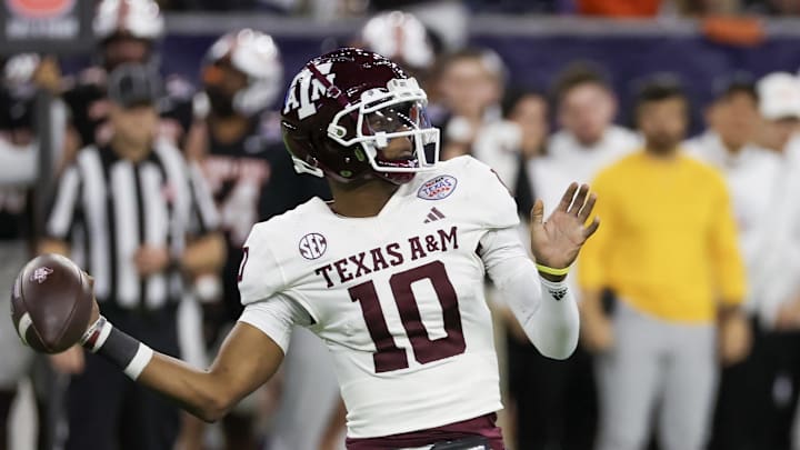 Dec 27, 2023; Houston, TX, USA; Texas A&M Aggies quarterback Marcel Reed (10) drops back to pass against the Oklahoma State Cowboys in the second quarter at NRG Stadium. Mandatory Credit: Thomas Shea-Imagn Images