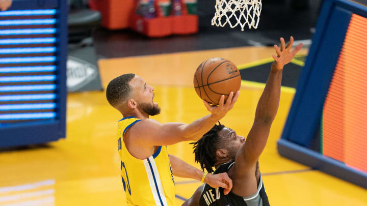 April 25, 2021; San Francisco, California, USA; Golden State Warriors guard Stephen Curry (30) shoots the basketball against Sacramento Kings guard Buddy Hield (24) during the third quarter at Chase Center. Mandatory Credit: Kyle Terada-USA TODAY Sports
