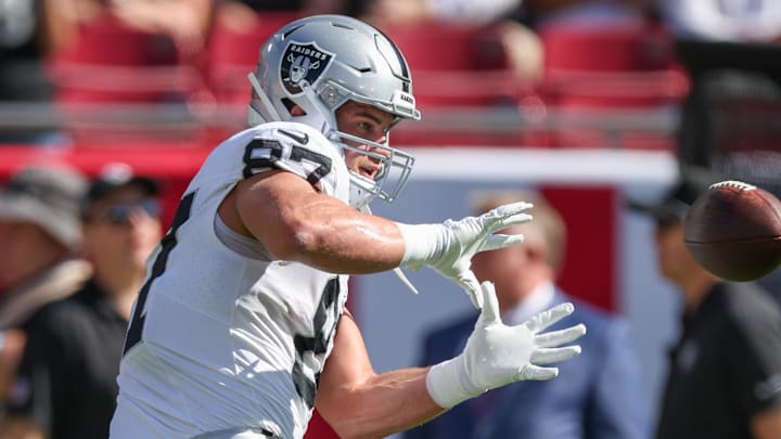Dec 8, 2024; Tampa, Florida, USA; Las Vegas Raiders tight end Michael Mayer (87) warms up before a game against the Tampa Bay Buccaneers at Raymond James Stadium. Mandatory Credit: Nathan Ray Seebeck-Imagn Images