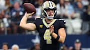 Sep 15, 2024; Arlington, Texas, USA;  New Orleans Saints quarterback Derek Carr (4) throws during the first half against the Dallas Cowboys at AT&T Stadium. Mandatory Credit: Kevin Jairaj-Imagn Images