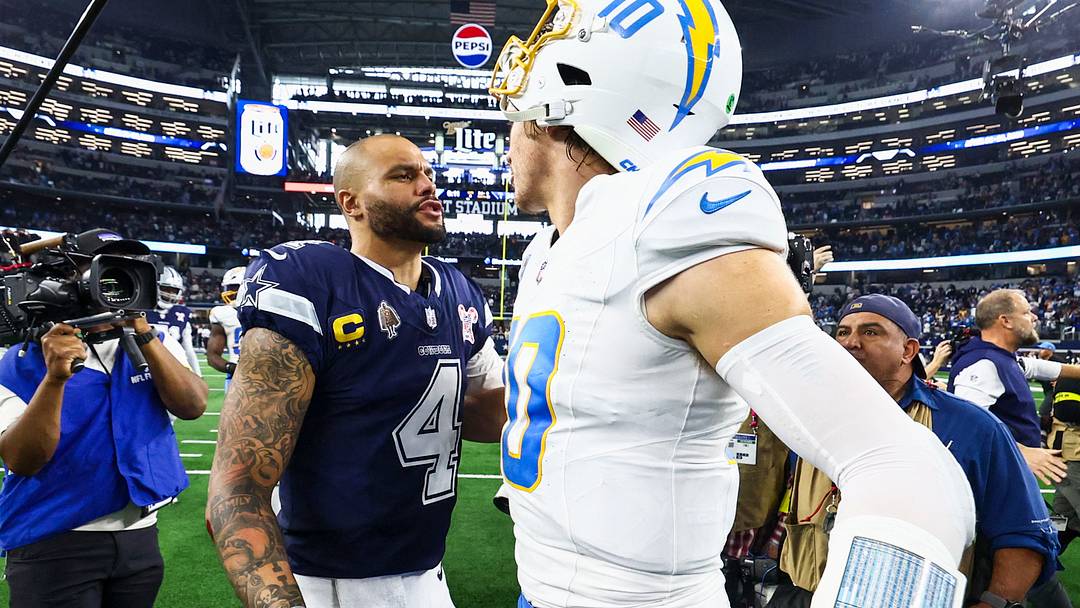 Dallas Cowboys QB Dak Prescott and Los Angeles Chargers QB Justin Herbert greet each other following a Chargers victory. Dallas Cowboys QB Dak Prescott and Los Angeles Chargers QB Justin Herbert greet each other following a Chargers victory.