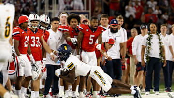 Sep 7, 2024; Tucson, Arizona, USA; Northern Arizona Lumberjack wide receiver Tay Lanier (8) catches the ball and falls while he keeps his feet in bounds as Arizona Wildcats team watches during fourth quarter at Arizona Stadium. Mandatory Credit: Aryanna Frank-Imagn Images