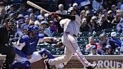 May 7, 2025; Chicago, Illinois, USA; San Francisco Giants first base LaMonte Wade Jr. (31) hits a one run double against the Chicago Cubs during the fourth inning at Wrigley Field.