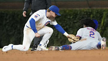 New York Mets pinch-runner Luisangel Acuna (2) steals second as Chicago Cubs second baseman Nico Hoerner (2) can’t handle a throw during the eighth inning at Wrigley Field. 