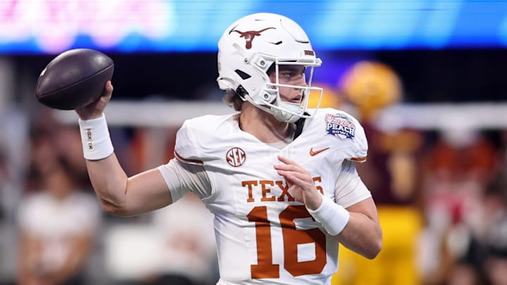 Texas Longhorns quarterback Arch Manning (16) warms up before the Peach Bowl at Mercedes-Benz Stadium. Texas Longhorns quarterback Arch Manning (16) warms up before the Peach Bowl at Mercedes-Benz Stadium.