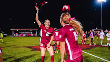 Arkansas soccer players celebrate against Alabama last week.
