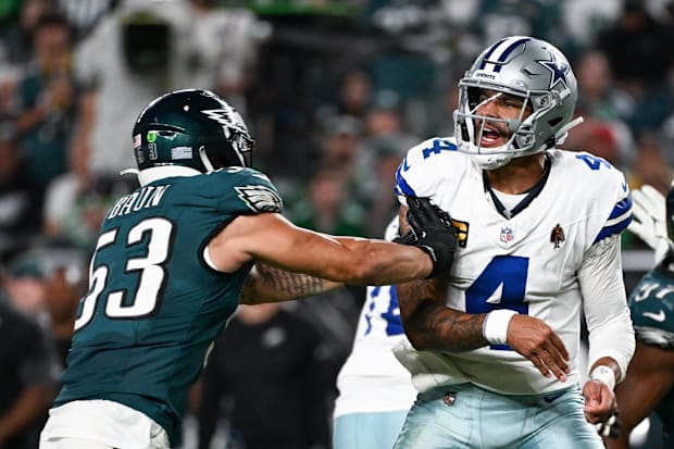 Philadelphia Eagles linebacker Zack Baun hits Dallas Cowboys quarterback Dak Prescott after a pass at Lincoln Financial Field