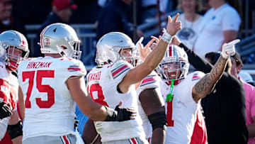 Ohio State Buckeyes quarterback Will Howard (18) celebrates a first down run during the NCAA football game against the Penn State Nittany Lions at Beaver Stadium in University Park, Pa. on Monday, Nov. 4, 2024. Ohio State won 20-13.