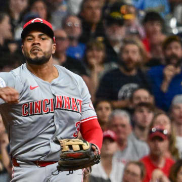 Jun 14, 2024; Milwaukee, Wisconsin, USA; Cincinnati Reds third baseman Jeimer Candelario (3) makes a throwing error allowing a run to score in the sixth inning against the Milwaukee Brewers at American Family Field. Mandatory Credit: Benny Sieu-USA TODAY Sports