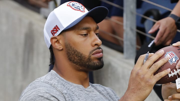 Aug 1, 2024; Canton, Ohio, USA; Chicago Bears defensive end Montez Sweat (98) signs autographs before the game against the Houston Texans at Tom Benson Hall of Fame Stadium. Mandatory Credit: Charles LeClaire-Imagn Images