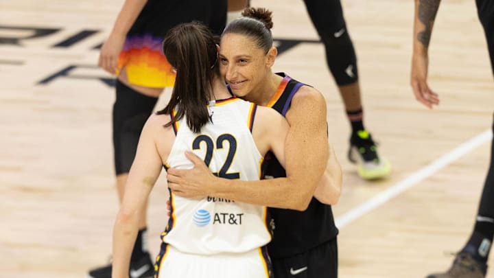 Phoenix Mercury guard Diana Taurasi (3) embraces Indiana Fever guard Caitlin Clark (22) before tipoff on June 30, 2024, at Footprint Center in Phoenix.