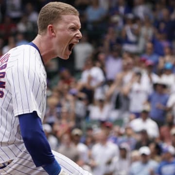 Jun 22, 2024; Chicago, Illinois, USA; Chicago Cubs outfielder Pete Crow-Armstrong (52) reacts after hitting an RBI triple against the New York Mets during the first inning at Wrigley Field.