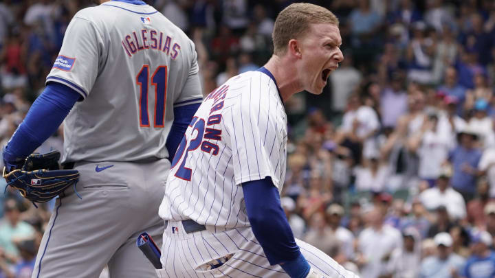 Jun 22, 2024; Chicago, Illinois, USA; Chicago Cubs outfielder Pete Crow-Armstrong (52) reacts after hitting an RBI triple against the New York Mets during the first inning at Wrigley Field.