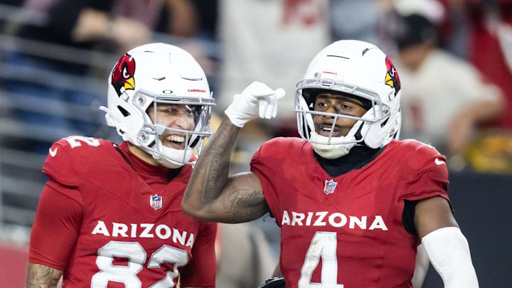 Nov 23, 2025; Glendale, Arizona, USA; Arizona Cardinals wide receiver Greg Dortch (4) celebrates a touchdown with teammate Andre Baccellia (82) against the Jacksonville Jaguars at State Farm Stadium. Mandatory Credit: Mark J. Rebilas-Imagn Images