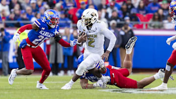 Nov 23, 2024; Kansas City, Missouri, USA;  Colorado quarterback Shedeur Sanders (2) scrambles for yardage during the 2nd quarter between the Kansas Jayhawks and the Colorado Buffaloes at GEHA Field at Arrowhead Stadium. Mandatory Credit: Nick Tre. Smith-Imagn Images