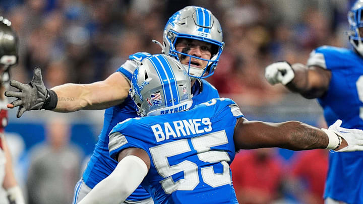 Detroit Lions defensive end Aidan Hutchinson (97) and linebacker Derrick Barnes (55) celebrate