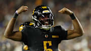  Washington Commanders quarterback Jayden Daniels (5) reacts after a play against the Chicago Bears during the second half at Northwest Stadium. Mandatory Credit: Geoff Burke-Imagn Images