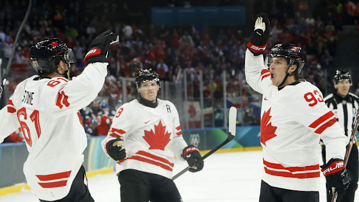 Feb 12, 2026; Milan, Italy; Mark Stone of Canada celebrates scoring their second goal with Mitch Marner of Canada against Czechia in a men's ice hockey group A match during the Milano Cortina 2026 Olympic Winter Games at Milano Santagiulia Ice Hockey Arena. Mandatory Credit: Geoff Burke-Imagn Images