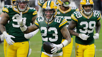 Green Bay Packers cornerback Jaire Alexander (23) celebrates a fourth-quarter interception against the Tampa Bay Buccaneers at Lambeau Field.