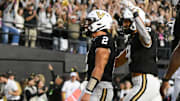 Oct 25, 2025; Nashville, Tennessee, USA;  Vanderbilt Commodores quarterback Diego Pavia (2) celebrates the touchdown of quarterback Diego Pavia (2) against the Missouri Tigers during the second half at FirstBank Stadium. Mandatory Credit: Steve Roberts-Imagn Images