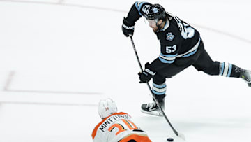 Dec 22, 2024; Salt Lake City, Utah, USA; Utah Hockey Club left wing Michael Carcone (53) shoots the puck during the third period against the Anaheim Ducks at Delta Center. Mandatory Credit: Chris Nicoll-Imagn Images