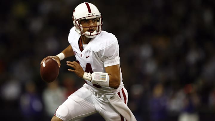 Sept 27, 2008; Seattle, WA, USA; Stanford Cardinal quarterback Tavita Pritchard (14) scrambles out of the pocket against the Washington Huskies during the first half at Husky Stadium. Stanford defeated Washington, 35-28. Mandatory Credit: Joe Nicholson-Imagn Images