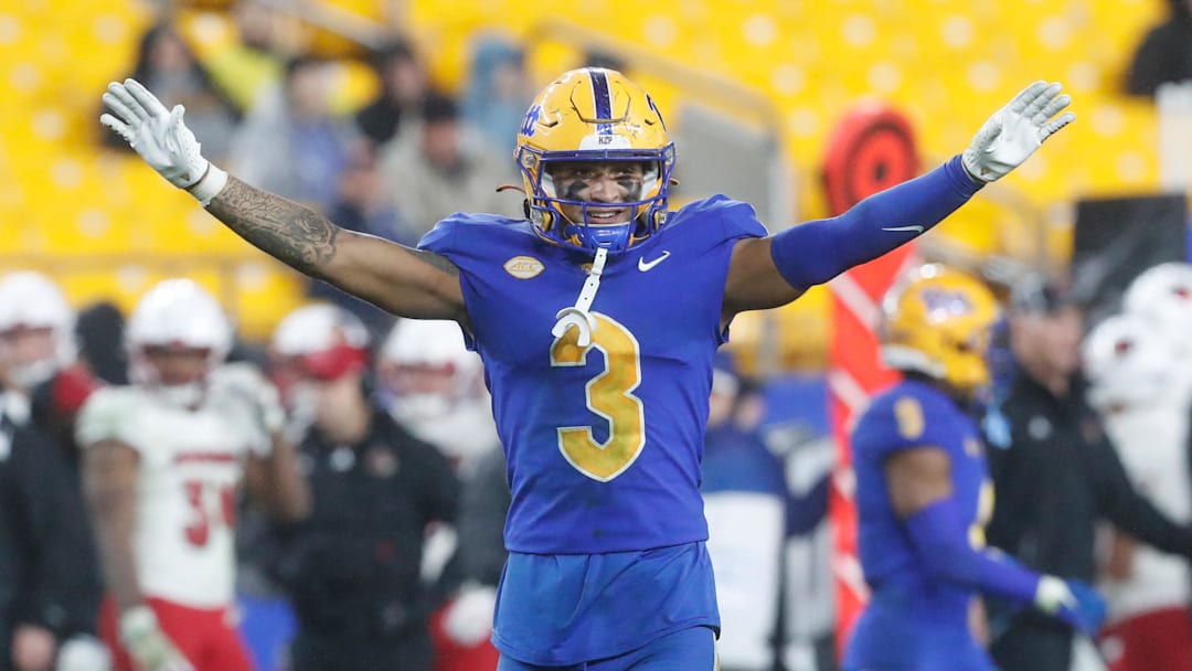 Oct 14, 2023; Pittsburgh, Pennsylvania, USA;  Pittsburgh Panthers defensive back Donovan McMillon (3) reacts after a defensive stop against the Louisville Cardinals during the fourth quarter at Acrisure Stadium. Mandatory Credit: Charles LeClaire-Imagn Images