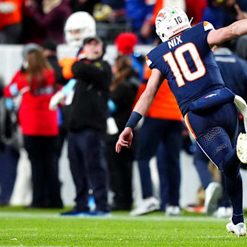 Dec 2, 2024; Denver, Colorado, USA; Denver Broncos quarterback Bo Nix (10) celebrates following a touchdown in the third quarter against the Cleveland Browns at Empower Field at Mile High. 