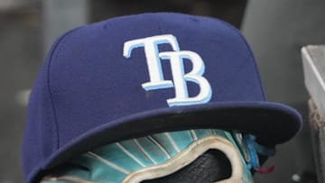 Sep 26, 2025; Toronto, Ontario, CAN; The hat and glove of Tampa Bay Rays third baseman Junior Caminero (13) in the dugout during the game against the Toronto Blue Jays at Rogers Centre. 