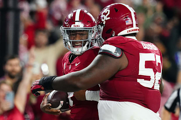 Alabama Crimson Tide quarterback Jalen Milroe celebrates his touchdown with offensive lineman Tyler Booker